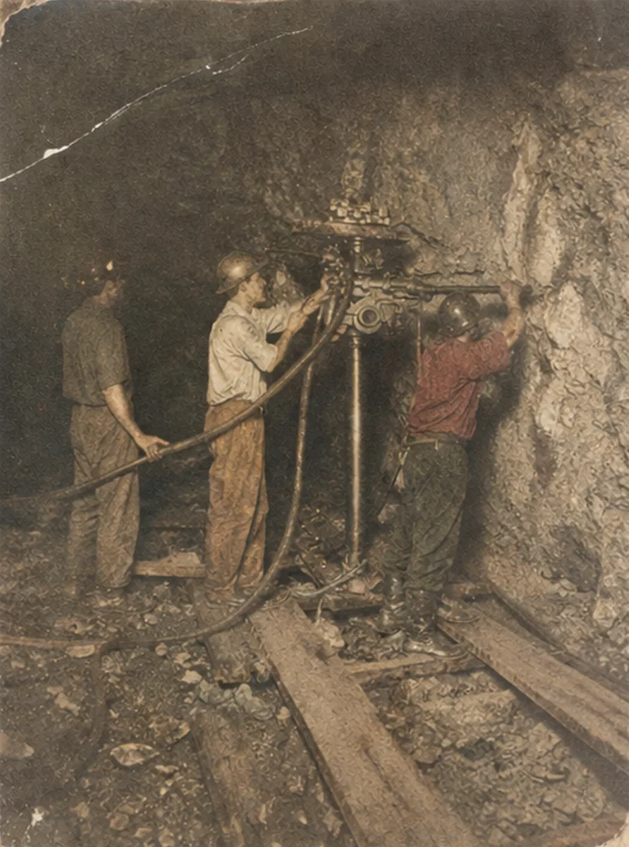 Kalgoorlie gold miners working underground with a rock drill, Western Australia 1920s — where Billy McCrae was given the Swan in the Circle pendant